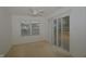 Serene bedroom with a ceiling fan, sliding glass door, and bright natural light at 5250 Shamus Dr, Indianapolis, IN 46235