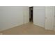 Bedroom featuring doors and trim; also featuring white walls and neutral carpet at 5250 Shamus Dr, Indianapolis, IN 46235