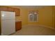 Open kitchen space with a refrigerator, a window for natural light, and ample counter space at 5250 Shamus Dr, Indianapolis, IN 46235