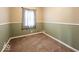 Small bedroom with carpet and neutral-toned walls at 64 S 10Th Ave, Beech Grove, IN 46107