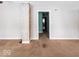 Living room with carpet, brick fireplace, and view into another room at 64 S 10Th Ave, Beech Grove, IN 46107