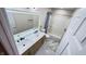 Bathroom featuring a double vanity with marble counters and modern fixtures, with a shower tub combo at 13271 Lorenzo Blvd, Carmel, IN 46074