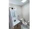 Well-lit bathroom featuring a modern vanity, sleek fixtures, and marble-style flooring at 13271 Lorenzo Blvd, Carmel, IN 46074