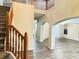 Open foyer with wood railing staircase, hardwood floors and spacious views into the living spaces at 13271 Lorenzo Blvd, Carmel, IN 46074