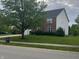 View of the home's front yard with lush green grass and mature shade trees at 13271 Lorenzo Blvd, Carmel, IN 46074