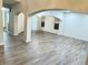 Spacious open-concept living room featuring hardwood floors and large windows for natural light at 13271 Lorenzo Blvd, Carmel, IN 46074