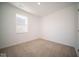 Simple bedroom with neutral carpeting and window at 1390 Foxtail Ln, Greenwood, IN 46143