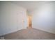 Bright bedroom with neutral carpeting and access to another room at 1390 Foxtail Ln, Greenwood, IN 46143