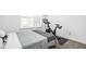 Bright bedroom with a queen bed and Peloton bike at 1825 N New Jersey St, Indianapolis, IN 46202
