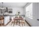 Bright dining area with wood table and four chairs, near kitchen at 1825 N New Jersey St, Indianapolis, IN 46202