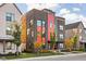 Modern three-story home with brick and metal siding, showcasing a stylish design at 1825 N New Jersey St, Indianapolis, IN 46202