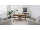 Bright office space with wooden desk, armchairs, and natural light at 1825 N New Jersey St, Indianapolis, IN 46202
