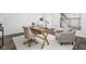 Home office with wooden desk, armchairs, and natural light at 1825 N New Jersey St, Indianapolis, IN 46202