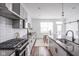 Open concept kitchen with stainless steel appliances and eat-in dining area at 1825 N New Jersey St, Indianapolis, IN 46202