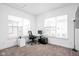 Home office with windowed corner, desk, chair, and storage at 1825 N New Jersey St, Indianapolis, IN 46202