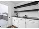 Modern wet bar with floating shelves and sink at 1825 N New Jersey St, Indianapolis, IN 46202