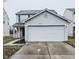 Two-story house with attached garage and neutral siding at 4056 Orchard Valley Ln, Indianapolis, IN 46235