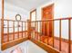 Upper hallway with wood flooring and built-in bench at 4509 Madison Ave, Anderson, IN 46013