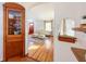 View of living room from dining area, hardwood floors, and vintage furniture at 4509 Madison Ave, Anderson, IN 46013