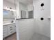 Modern bathroom with a walk-in shower featuring white patterned tiles and a double sink vanity at 537 Gilder Dr, Carmel, IN 46032