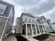 New two-story home featuring a covered front porch with classic columns and landscaping at 537 Gilder Dr, Carmel, IN 46032