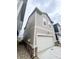 Two-story home featuring a two-car garage, neutral siding, and brick accents at 537 Gilder Dr, Carmel, IN 46032