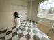 Laundry room features a water softener, shelving, and a built in sink at 6936 W Briarwood Blvd, New Palestine, IN 46163