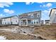 Exterior view of gray home and backyard with covered porch, ready for landscaping at 20397 Hudson Bay Ln, Westfield, IN 46074