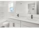 Modern bathroom with double sink vanity, dark hardware, and a tiled shower-tub combination at 20397 Hudson Bay Ln, Westfield, IN 46074
