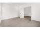 Spacious bedroom with neutral carpet, white walls, and a doorway leading to another room at 20397 Hudson Bay Ln, Westfield, IN 46074