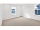 Neutral bedroom with carpeted floors and two bright windows at 20397 Hudson Bay Ln, Westfield, IN 46074