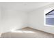 Sunny bedroom featuring neutral carpet, white walls, and a window bringing in natural light at 20397 Hudson Bay Ln, Westfield, IN 46074