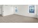 Bright bedroom featuring carpet, two windows, and a closet with ample natural light at 20397 Hudson Bay Ln, Westfield, IN 46074