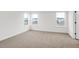 Well-lit bedroom with three windows, neutral carpet, and ample natural light at 20397 Hudson Bay Ln, Westfield, IN 46074