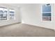 Bedroom showcasing neutral carpet, white walls, and windows that overlook the neighborhood at 20397 Hudson Bay Ln, Westfield, IN 46074