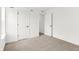 Bright bedroom featuring neutral carpet, white walls, and an en-suite bathroom entry at 20397 Hudson Bay Ln, Westfield, IN 46074