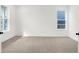 Bright bedroom with neutral carpeting, white walls, and windows providing ample natural light at 20397 Hudson Bay Ln, Westfield, IN 46074