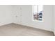 Bedroom featuring neutral carpet, white walls, and a window with a view of the neighborhood at 20397 Hudson Bay Ln, Westfield, IN 46074