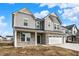 A beautifully designed two-story home with stone details, a double garage, and an inviting facade at 20397 Hudson Bay Ln, Westfield, IN 46074