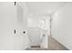 Bright upstairs hallway with carpeted floors and white trim at 20397 Hudson Bay Ln, Westfield, IN 46074