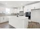 Bright kitchen featuring white cabinetry, modern appliances, and a large island at 20397 Hudson Bay Ln, Westfield, IN 46074