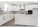 Bright kitchen featuring white cabinetry, modern appliances, and a large island at 20397 Hudson Bay Ln, Westfield, IN 46074