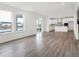Spacious open-concept living area leading into a modern kitchen with an island and stainless appliances at 20397 Hudson Bay Ln, Westfield, IN 46074