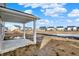 View from a home's covered patio overlooking a community with many other houses and a small pond at 20397 Hudson Bay Ln, Westfield, IN 46074