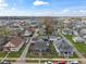 Street aerial view showcases the neighborhood and location of the blue house in the distance at 323 E Franklin St, Shelbyville, IN 46176