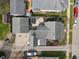 Aerial view of the house and detached garages show roof and back yard details at 323 E Franklin St, Shelbyville, IN 46176