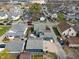 Aerial view of the house and detached garages show roof and back yard within the community at 323 E Franklin St, Shelbyville, IN 46176