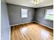 Bedroom featuring hardwood floors and large windows for natural light at 4619 Mac Dr, Anderson, IN 46013