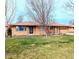 Charming one-story brick home featuring an attached one-car garage and a well-maintained front lawn at 4619 Mac Dr, Anderson, IN 46013