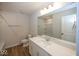 Well-lit bathroom with a large mirror, white cabinets, and modern fixtures at 4991 Elaine Ct, Noblesville, IN 46062